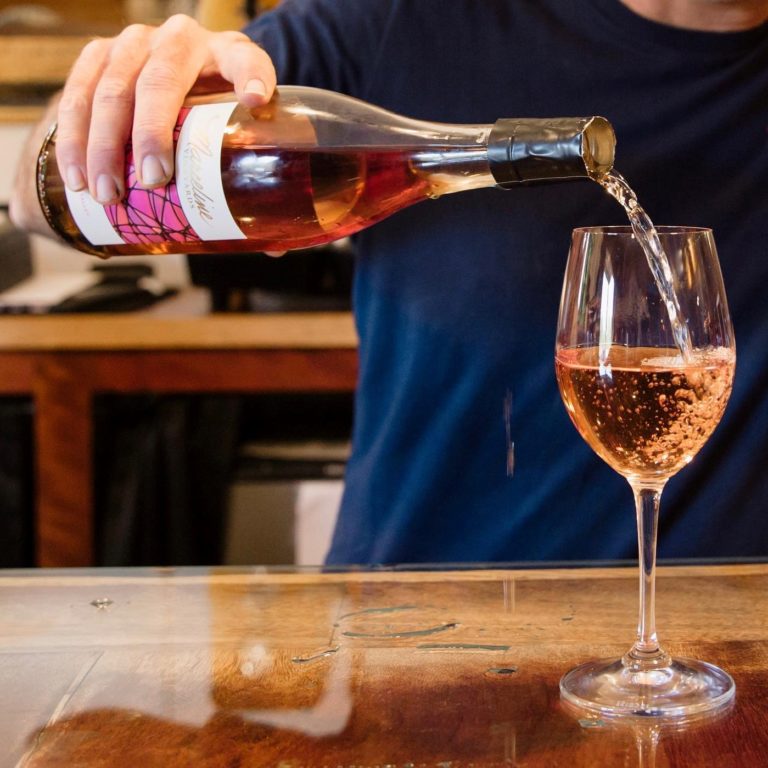 An image of a rosé wine being poured at Marceline Vineyards.